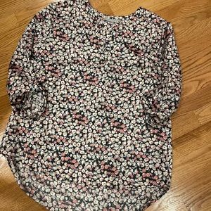 Beautiful pattern of pale rose, navy and cream. Longer hem in back